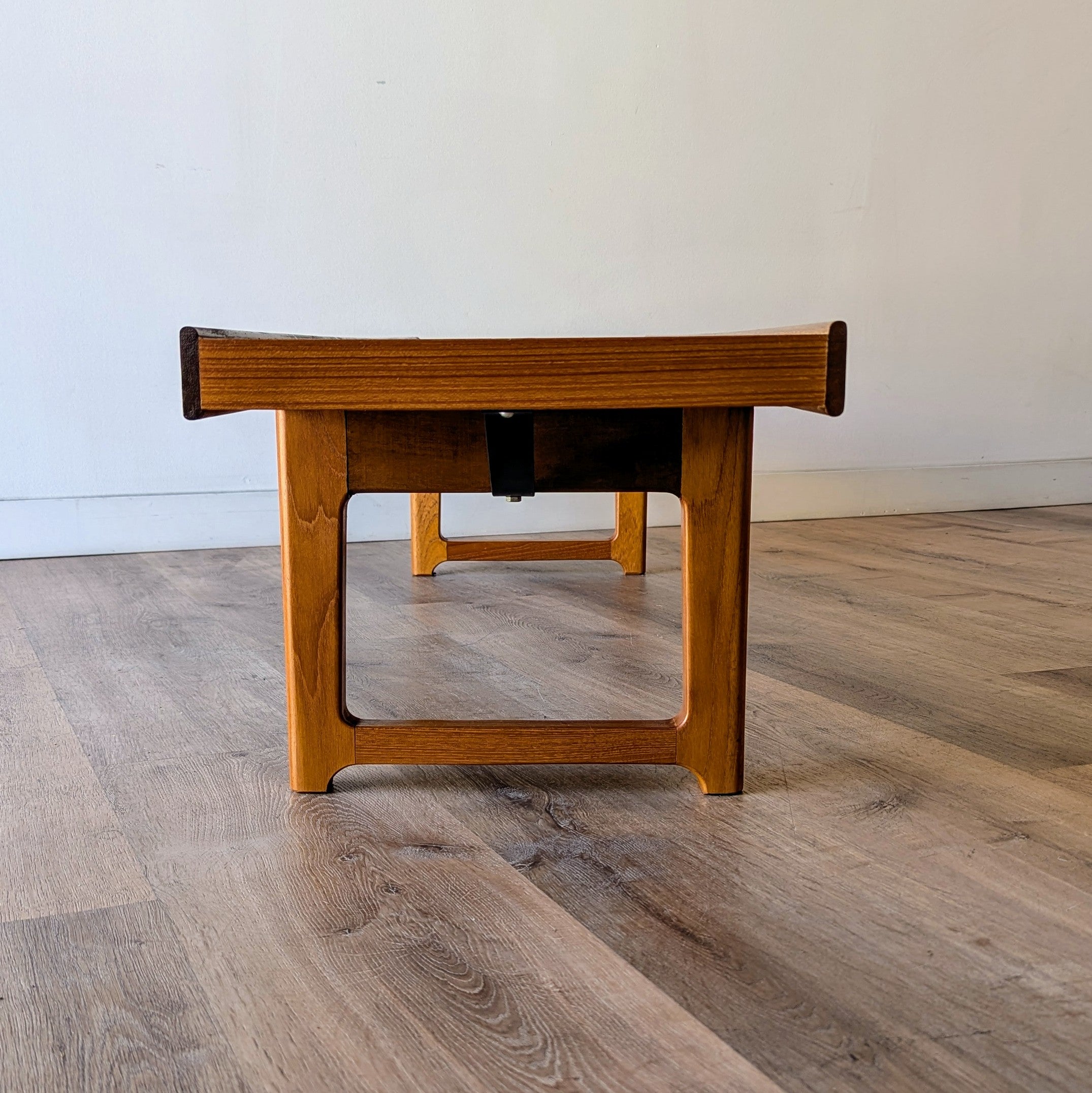 A teak Norwegian Modern 'Krobo' bench designed by Torbjørn Afdal at Sparklebarn in Seattle.