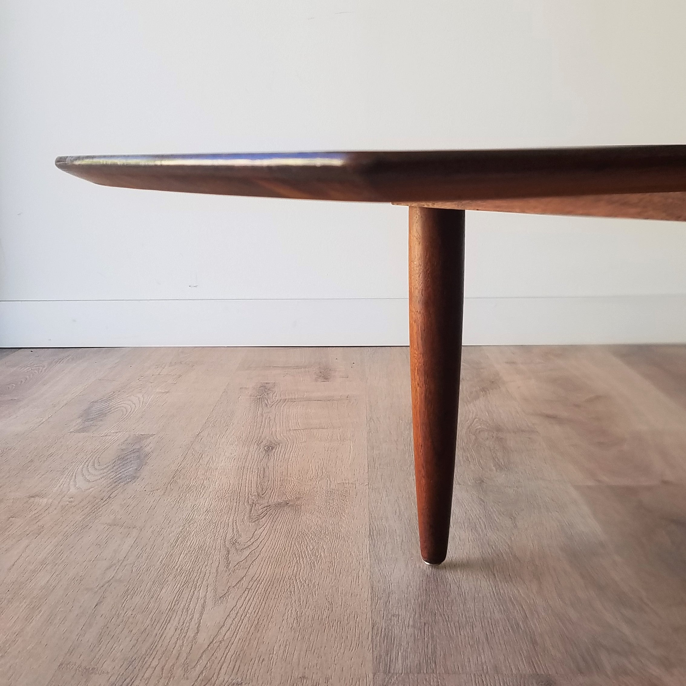 Detail view of Retro American Mid-Century Modern Prelude Walnut Surfboard Coffee Table in Seattle, Washington.