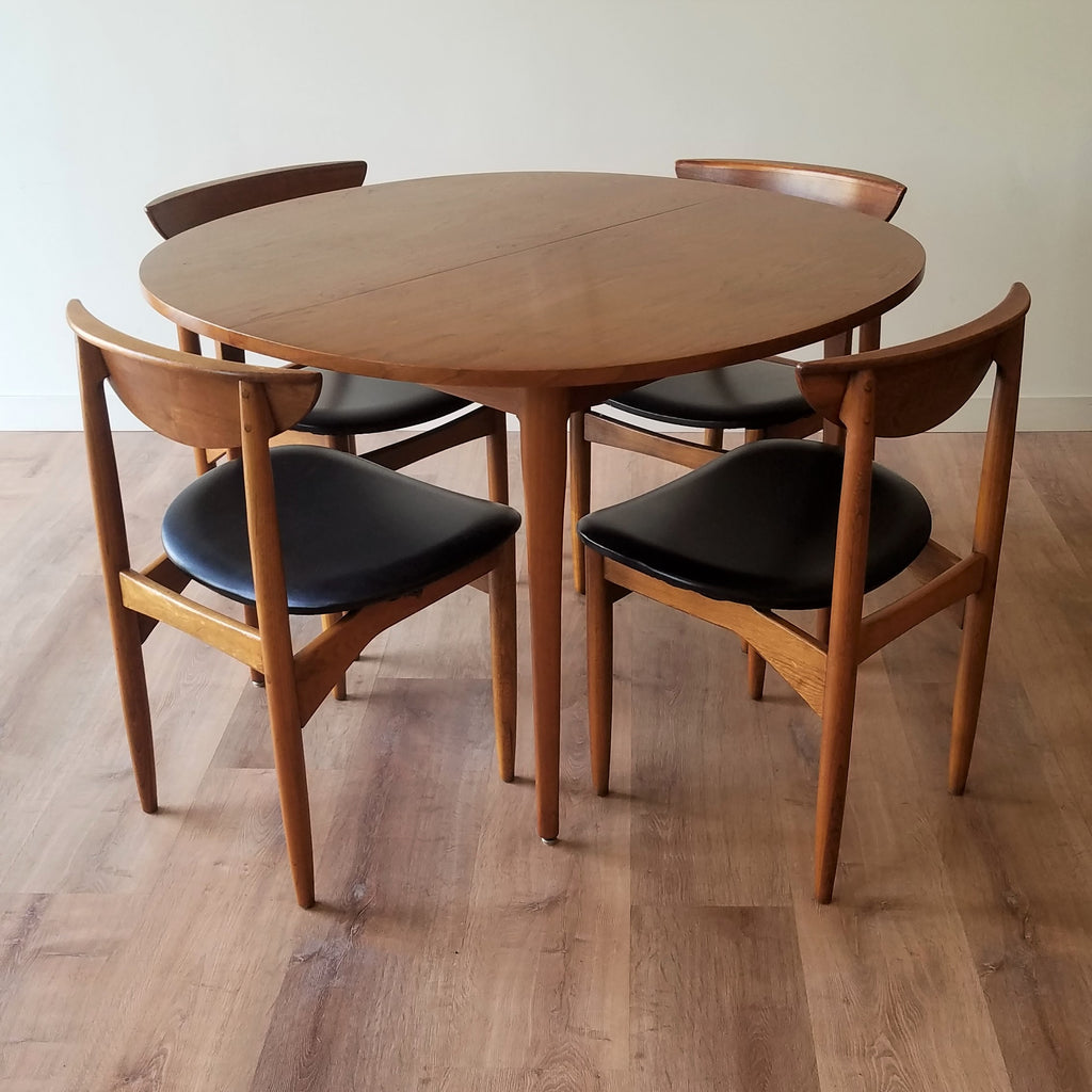 Overview of Round MCM Walnut Dining Table designed by Kipp Stewart for Drexel paired with Drexel Declaration Dining Chairs. See this and other great restored vintage Mid-Century Modern furniture at SPARKLEBARN in Seattle, WA.