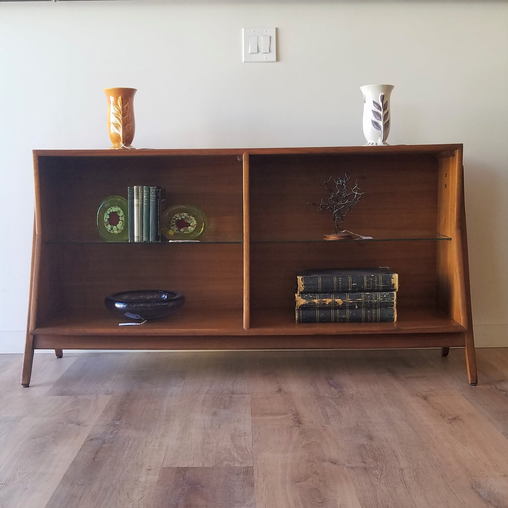 Frontl view of  an American Mid-Century Modern walnut bookcase designed by Kipp Stewart for Drexel. This bookcase and other great restored vintage furniture can be found at SPARKLEBARN in Ballard.