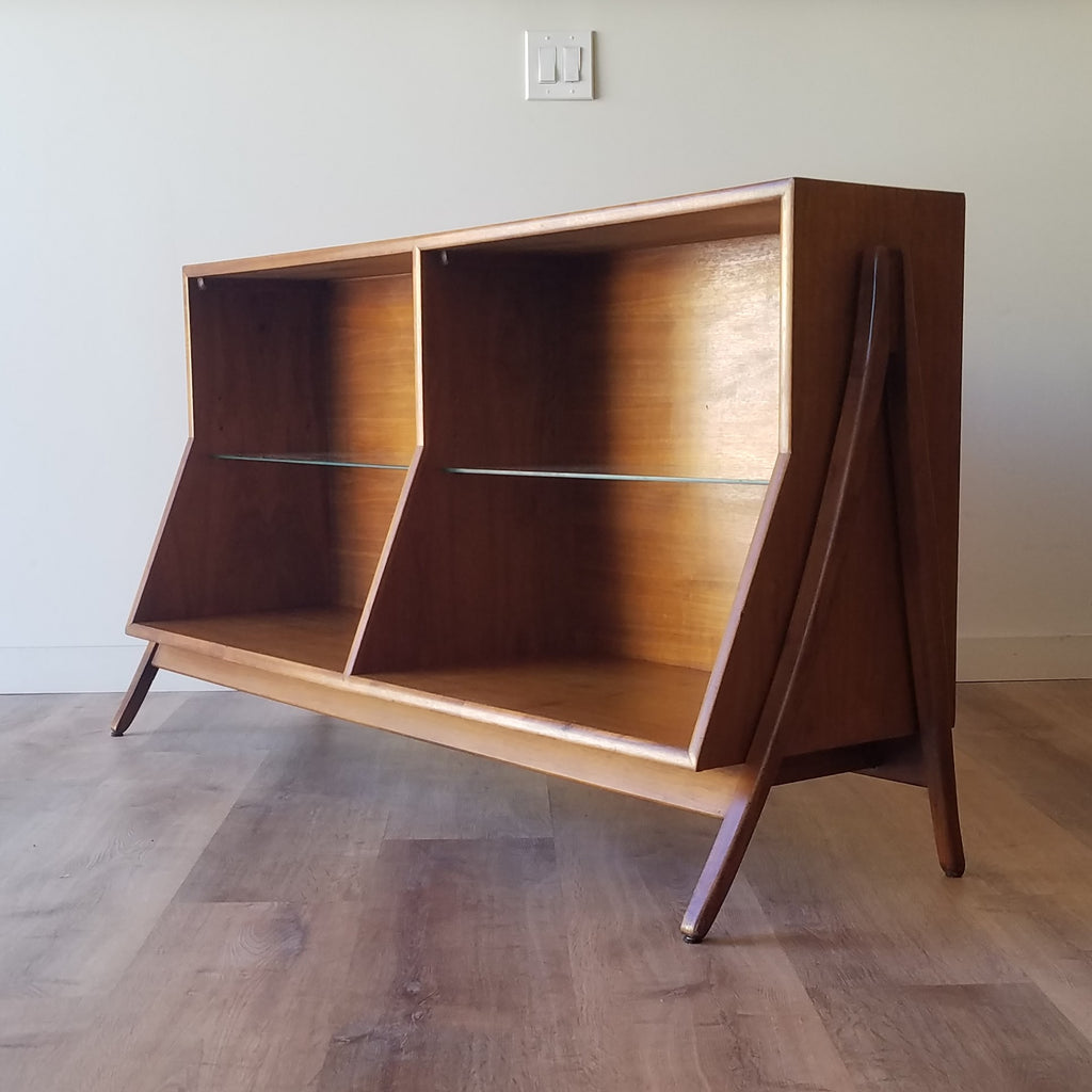 An American Mid-Century Modern walnut bookcase designed by Kipp Stewart for Drexel. This bookcase and other great restored vintage furniture can be found at SPARKLEBARN in Seattle, WA.