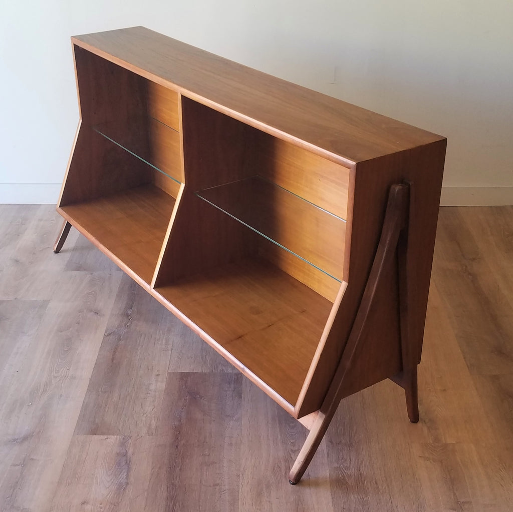 Quarter view of  an American Mid-Century Modern walnut bookcase designed by Kipp Stewart for Drexel. This bookcase and other great restored vintage furniture can be found at SPARKLEBARN in Washington State.