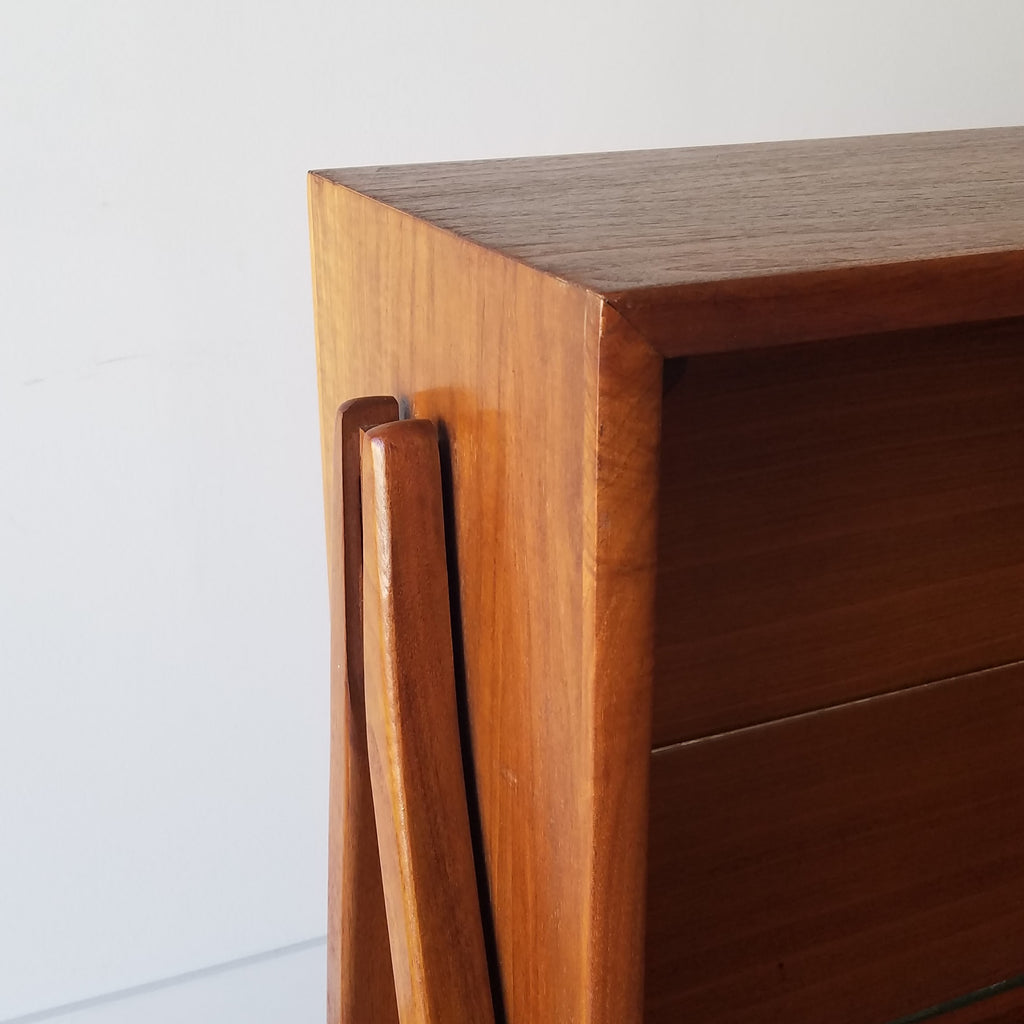 Detail view of  an American Mid-Century Modern walnut bookcase designed by Kipp Stewart for Drexel. This bookcase and other great restored vintage furniture can be found at SPARKLEBARN in Seattle, WA.