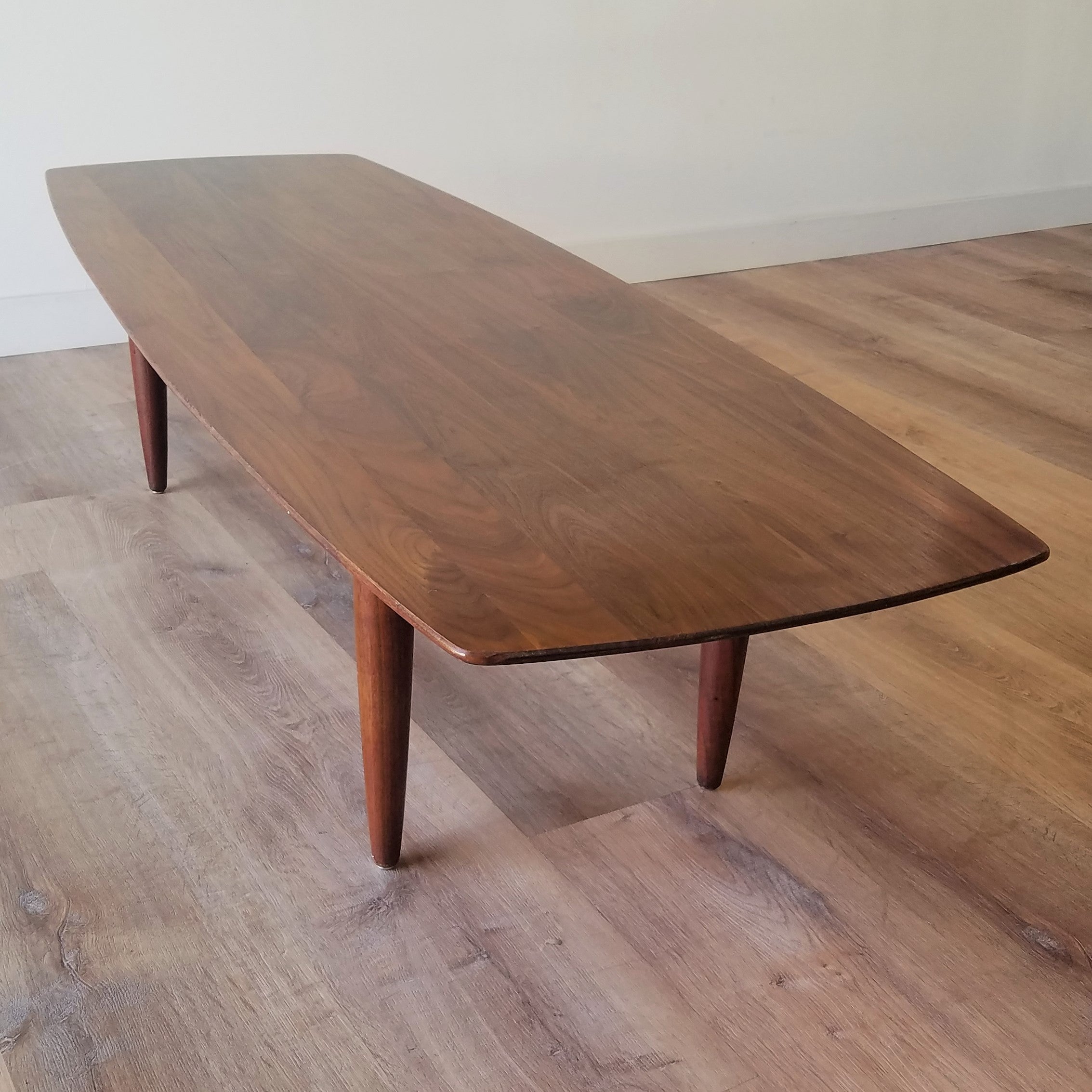 Front Angle view of Vintage American Mid-Century Modern Prelude Walnut Surfboard Coffee Table in Seattle, Washington.