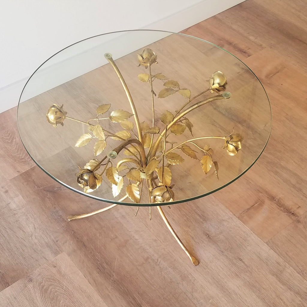 Detail view of a Hollywood Regency Side Table with Brass Roses and a glass top. This retro style and other vintage furniture can be found at SPARKLEBARN in Ballard.
