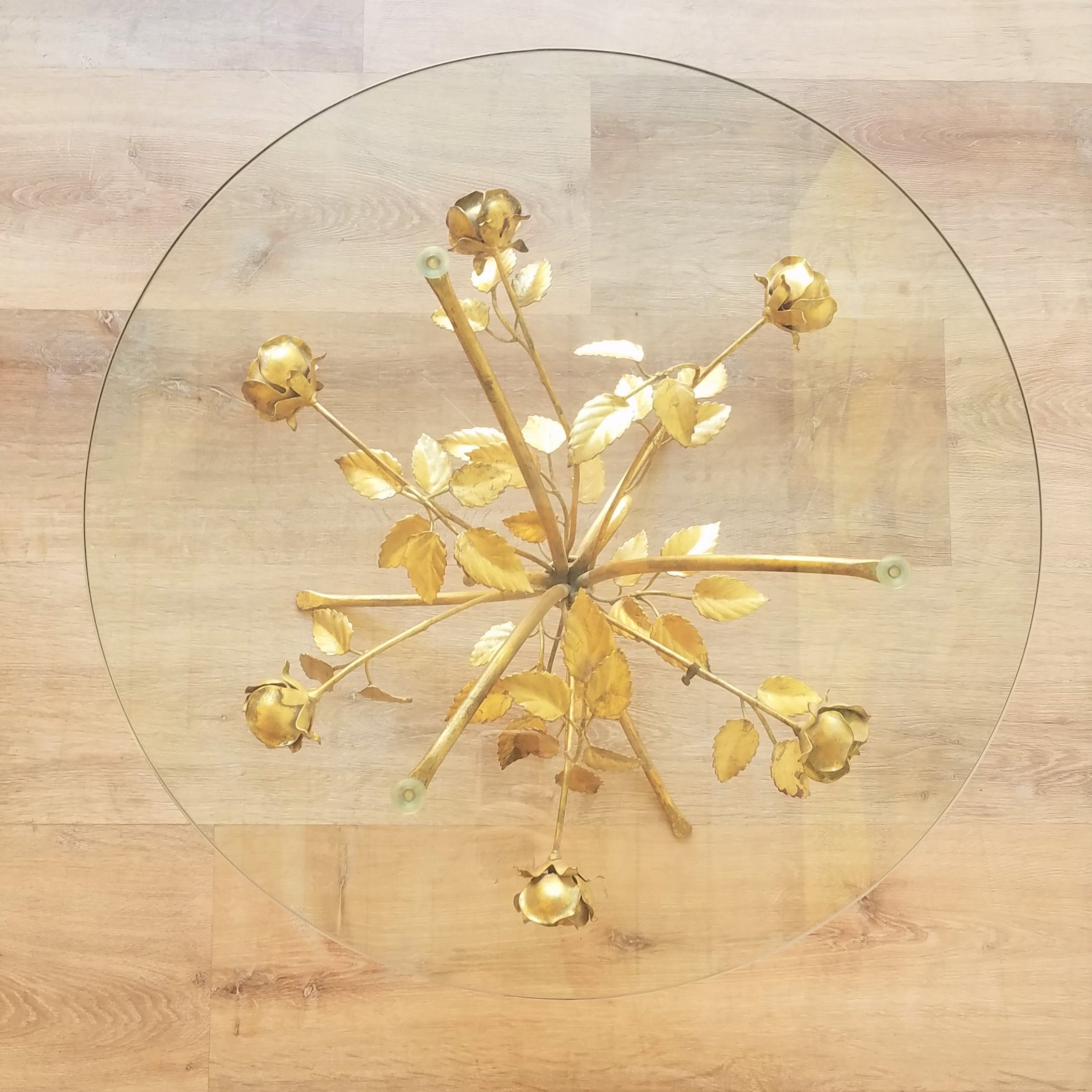 Top View of a Hollywood Regency Side Table with Brass Roses and a glass top. Find this at SPARKLEBARN, a vintage Mid-Century Modern furniture store in Seattle, WA.