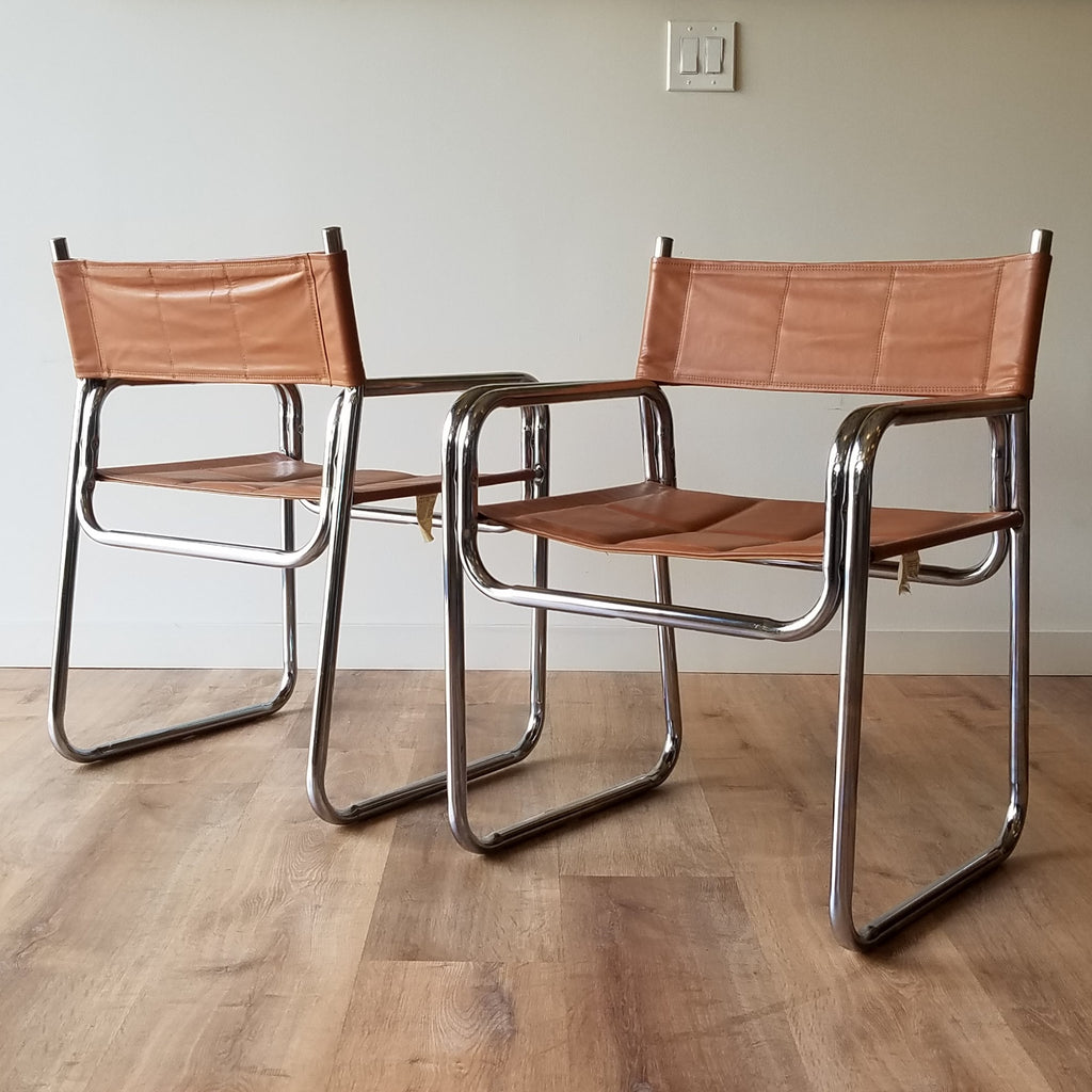 Front and Back Quarter View of a Pair of Mid-Century Modern Chrome Dining Chairs with Brown Vinyl Seat and Backrests. Find them at SPARKLEBARN in Ballard.