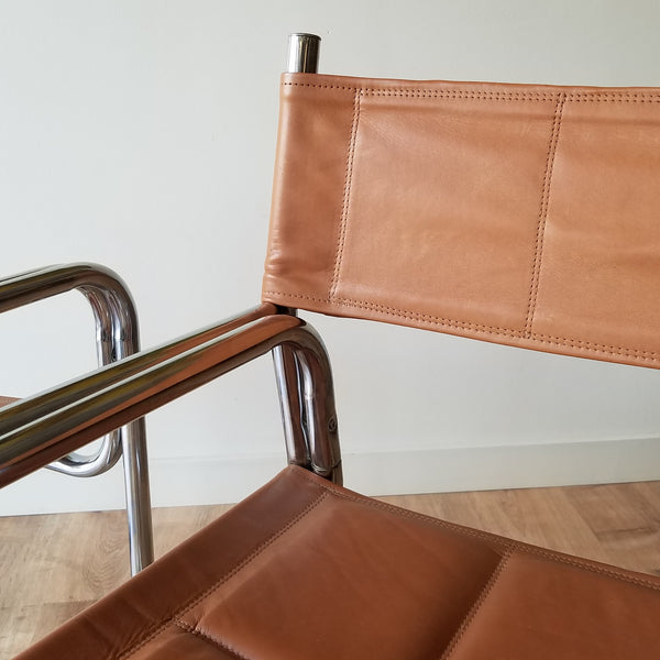 Detail View of a Set of eight MCM Chrome Dining Chairs with Brown Vinyl Seat and Backrests. Find them at SPARKLEBARN in Ballard.
