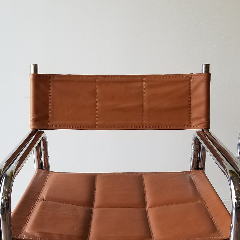 Detail View of a Colombian Chrome Dining Chairs with Brown Vinyl Seat and Backrests. Find them at SPARKLEBARN in Ballard.