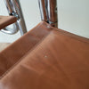 Detail View of a MCM Chrome Dining Chair with Brown Vinyl Seat and Backrests. Find them at SPARKLEBARN in Seattle, WA..