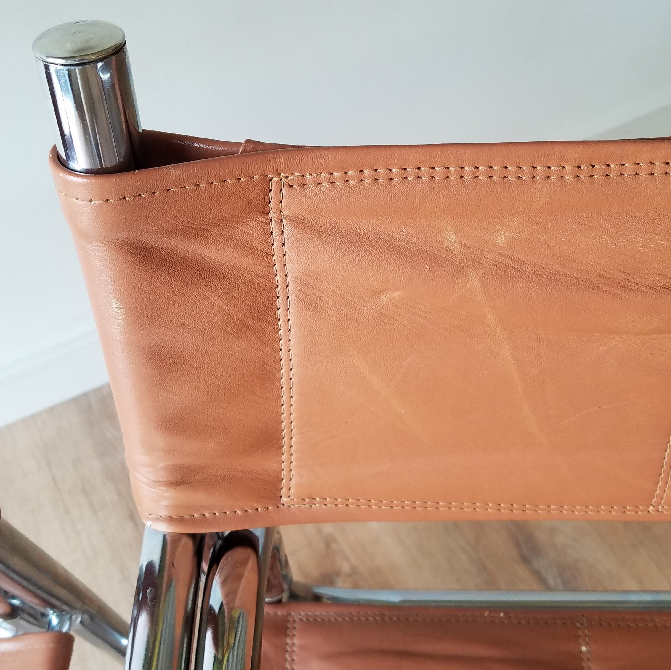 Detail View of a MCM Chrome Dining Chairs with Brown Vinyl Seat and Backrests. Find them at SPARKLEBARN in Seattle.