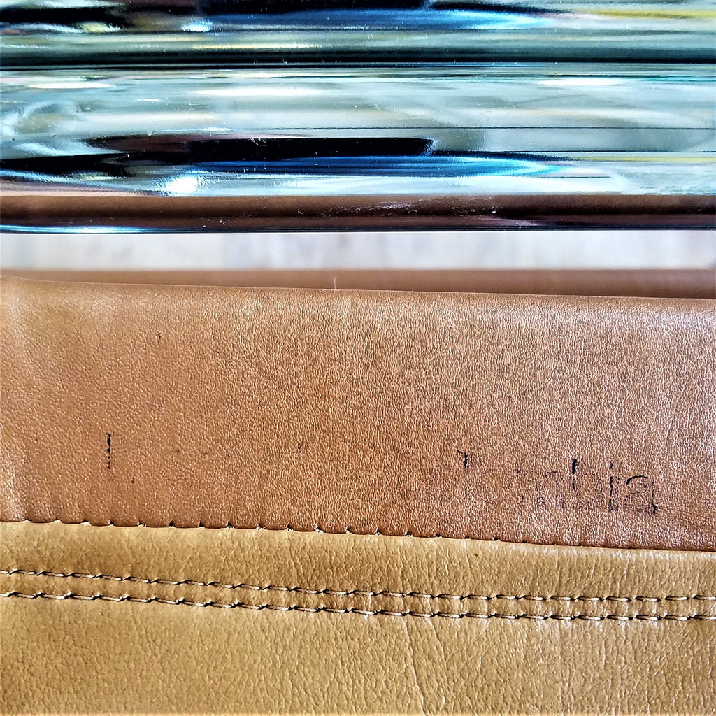 Makers Mark of a Mid-Century Modern Chrome Dining Chair made in Colombia with Brown Vinyl Seat and Backrests. Find them at SPARKLEBARN in Seattle.