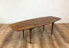 Quarter view of a walnut surfboard coffee table designed by Abel Sorensen for Knoll. Find this at SPARKLEBARN in Seattle, WA next to the Nordic Museum in Ballard.